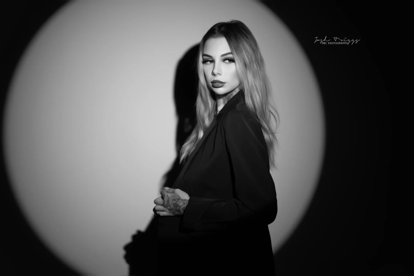 Erin Jaeckle, founder of Prestige Studios, in a black-and-white portrait